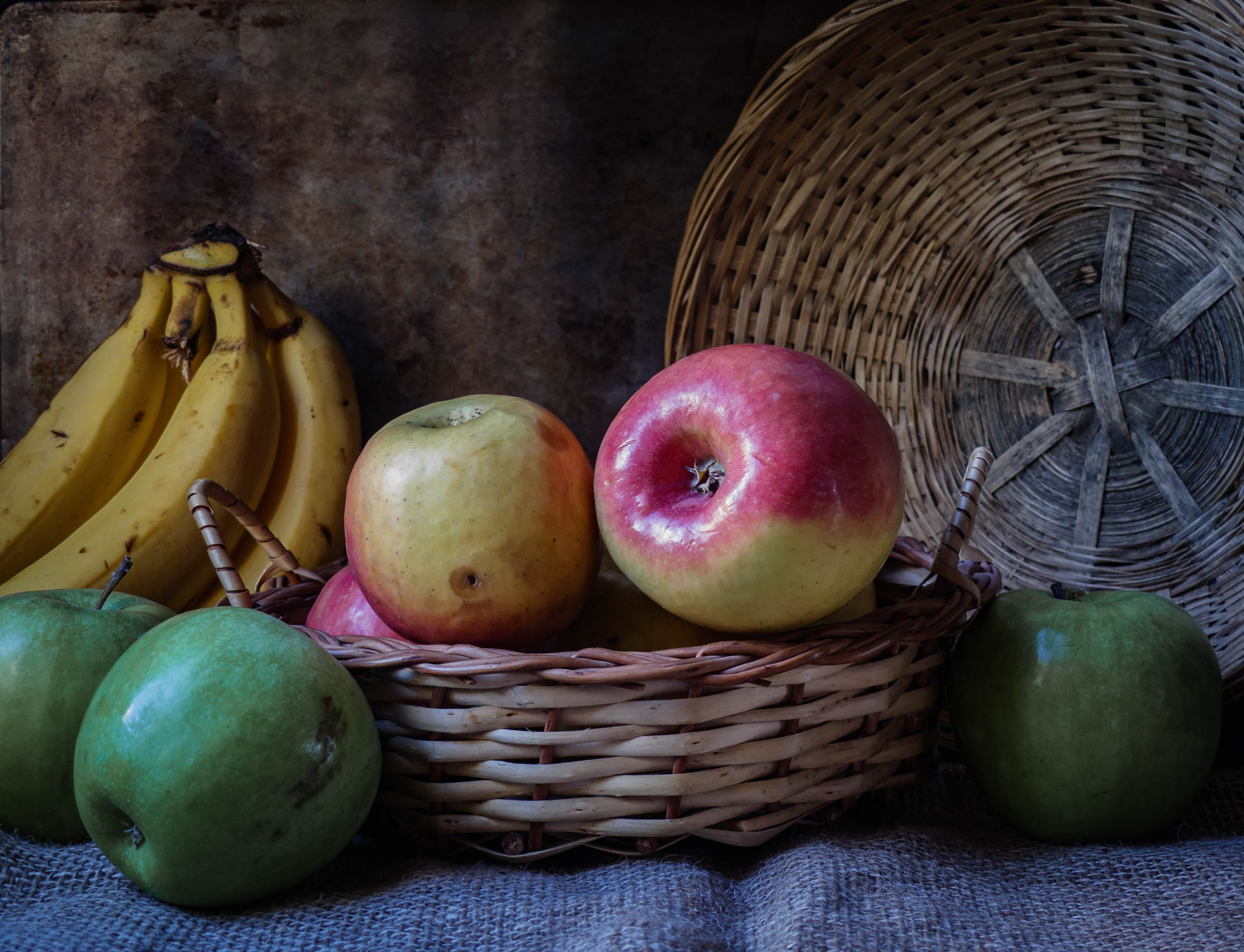 Apples and such arranged on a table.